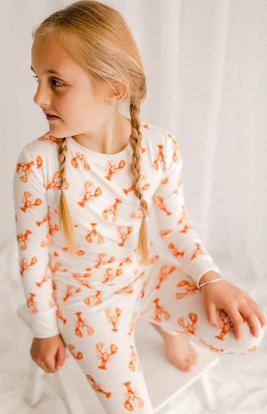 White pajama set with Maine lobsters in orange all over the set