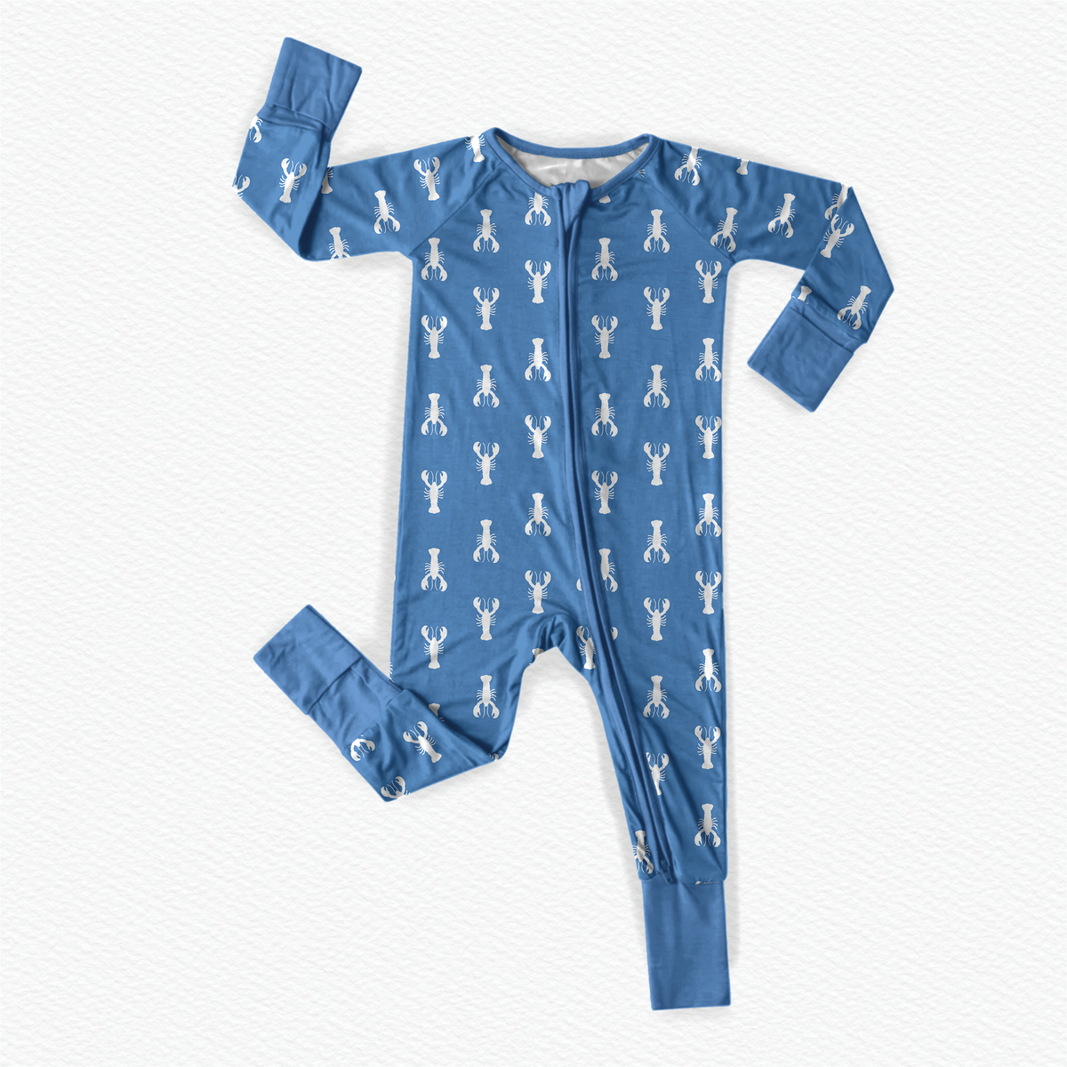 A blue long-sleeved baby onesie with a pattern of white lobsters on a blue background with blue cuffs