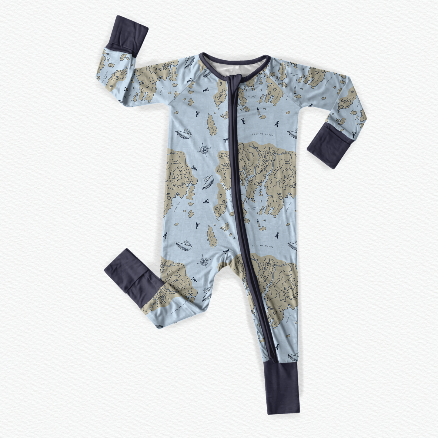 Baby onesie with the atlantic ocean, a piece of the maine coast, with blue lobsters, lobster boats, and navigation compasses.
