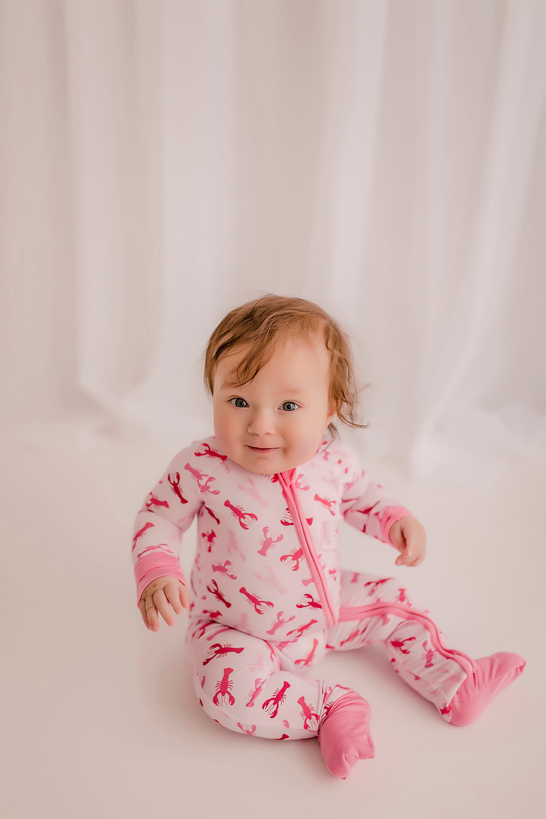 Maine-inspired pink lobster zippy romper for toddlers, size 12–18 months, featuring an all-over lobster print.