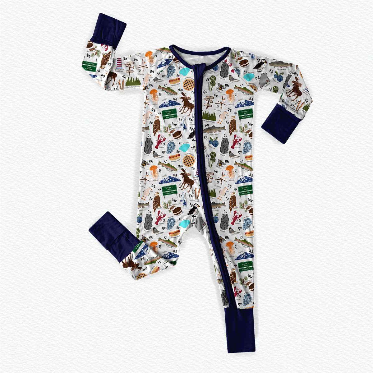 Children's onesie with Maine themed items to make up every letter of the alphabet with a white background and dark blue cuffs