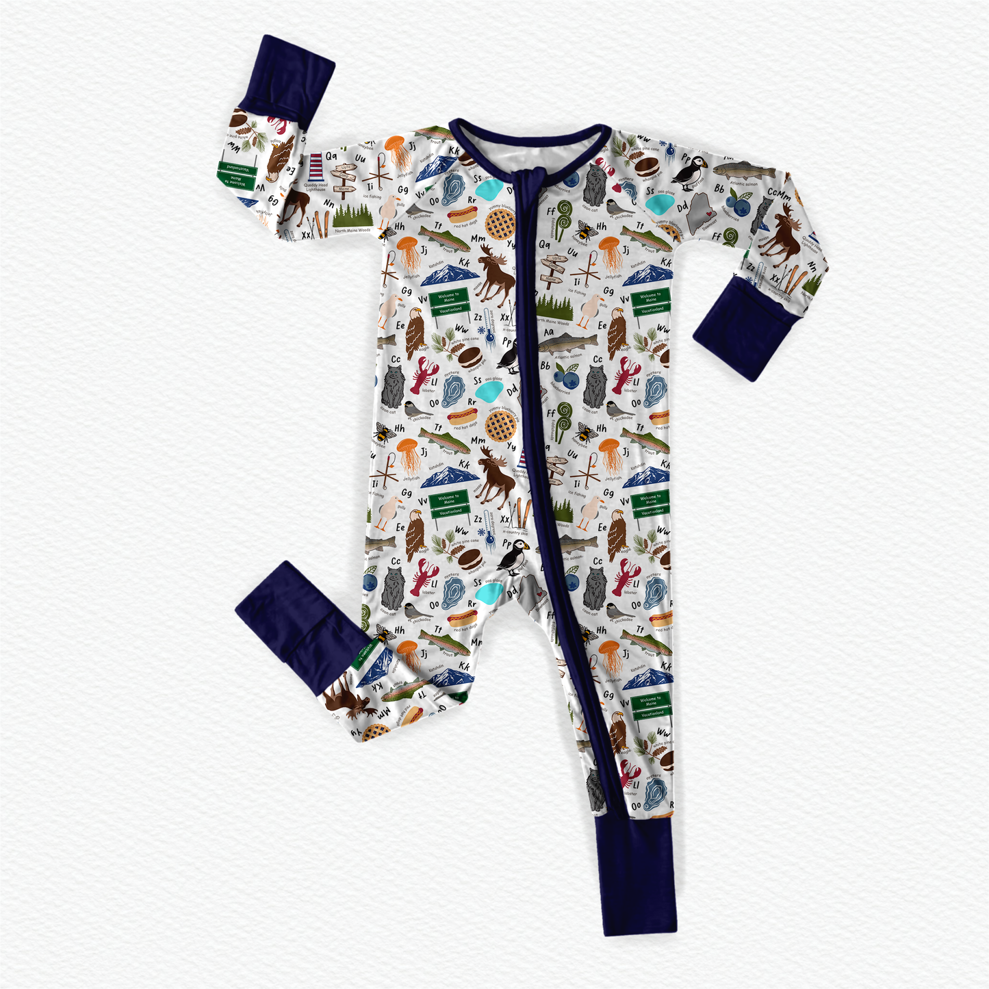 Children's onesie with Maine themed items to make up every letter of the alphabet with a white background and dark blue cuffs