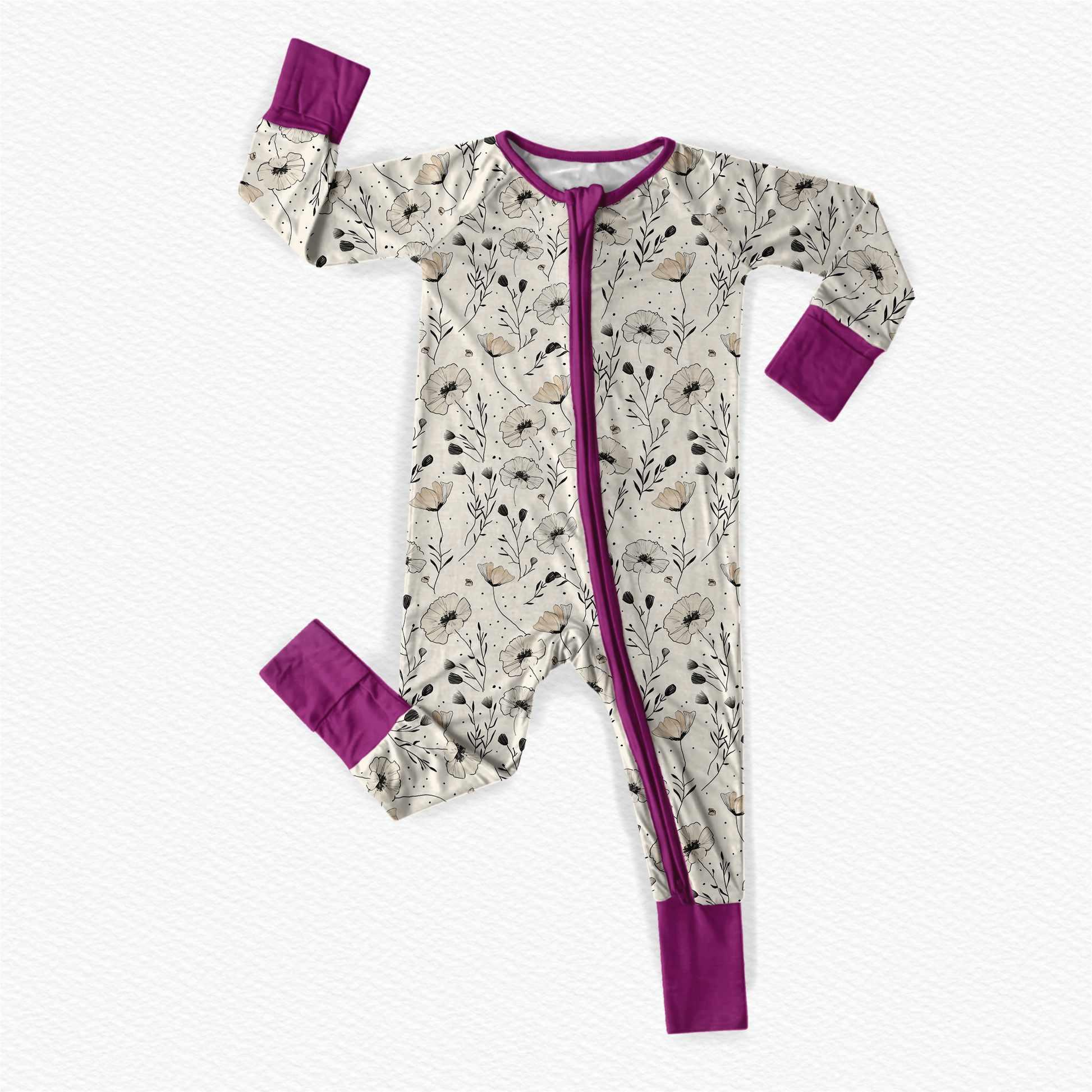 Baby one piece with floral pattern of the poppy flower on a off white colored background and purple accents 