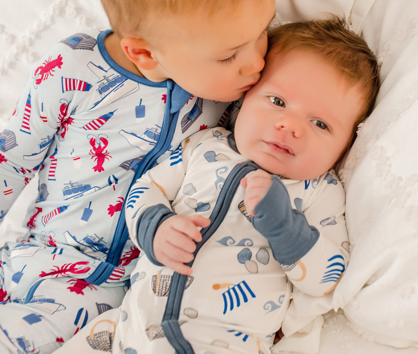Pajamas with clamming designs with all the necessary tools to go clamming in Maine, with blue, gray, and tan accents 
