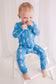 Child wearing light blue zippy with white lobsters and blue cuffs 
