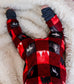 Red and black plaid zippy with nature-themed designs and the largest maine animal, the moose. 