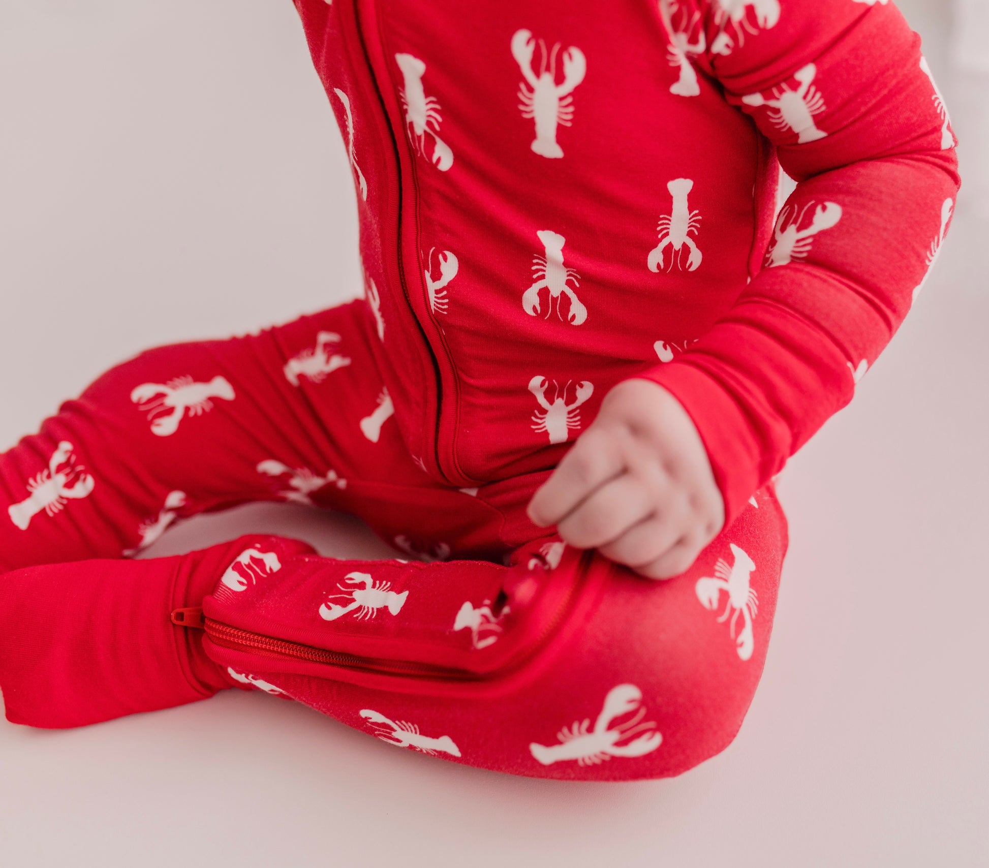 Red one piece pajama with white Maine lobsters and red cuffs 