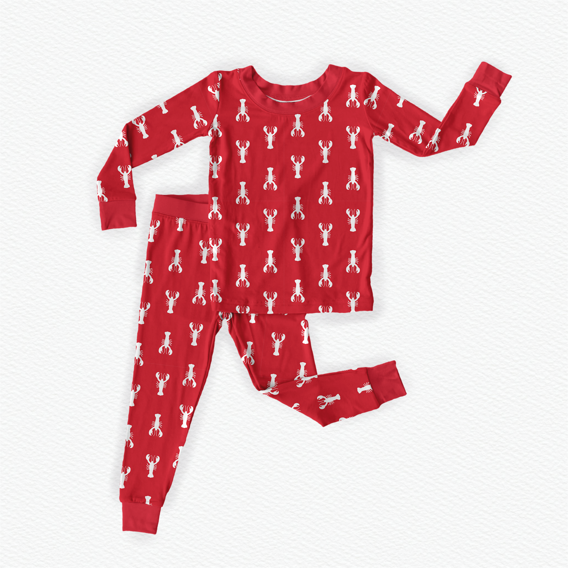 Long sleeved two piece pajama set of coastal Maine white lobsters on a red background 