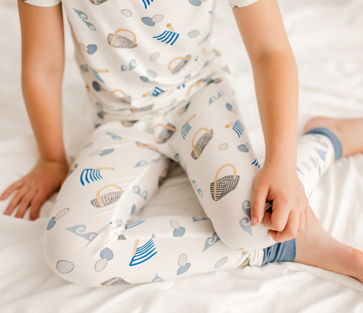 Maine clamming themed pajamas with waves, clam baskets, clams, and clam diggers. 