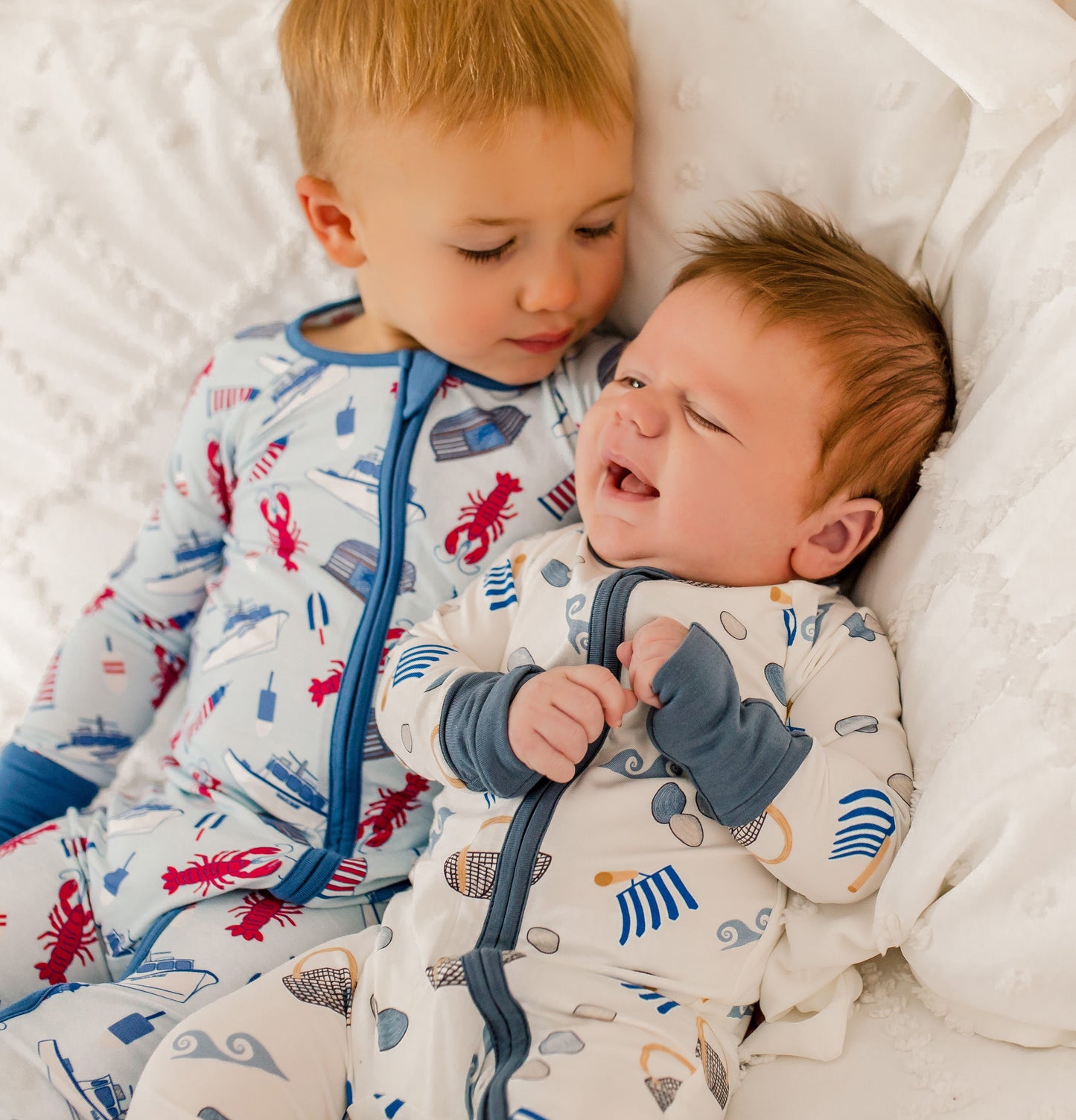 White pajamas with clams, diggers, baskets, and waves 