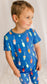 Child wearing a blue pajama set with all different color family buoys 