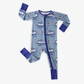 Children's blue onesie with lobster boat patterns, buoys, seagulls, and waves that all make up parts of the Maine fishing industry 