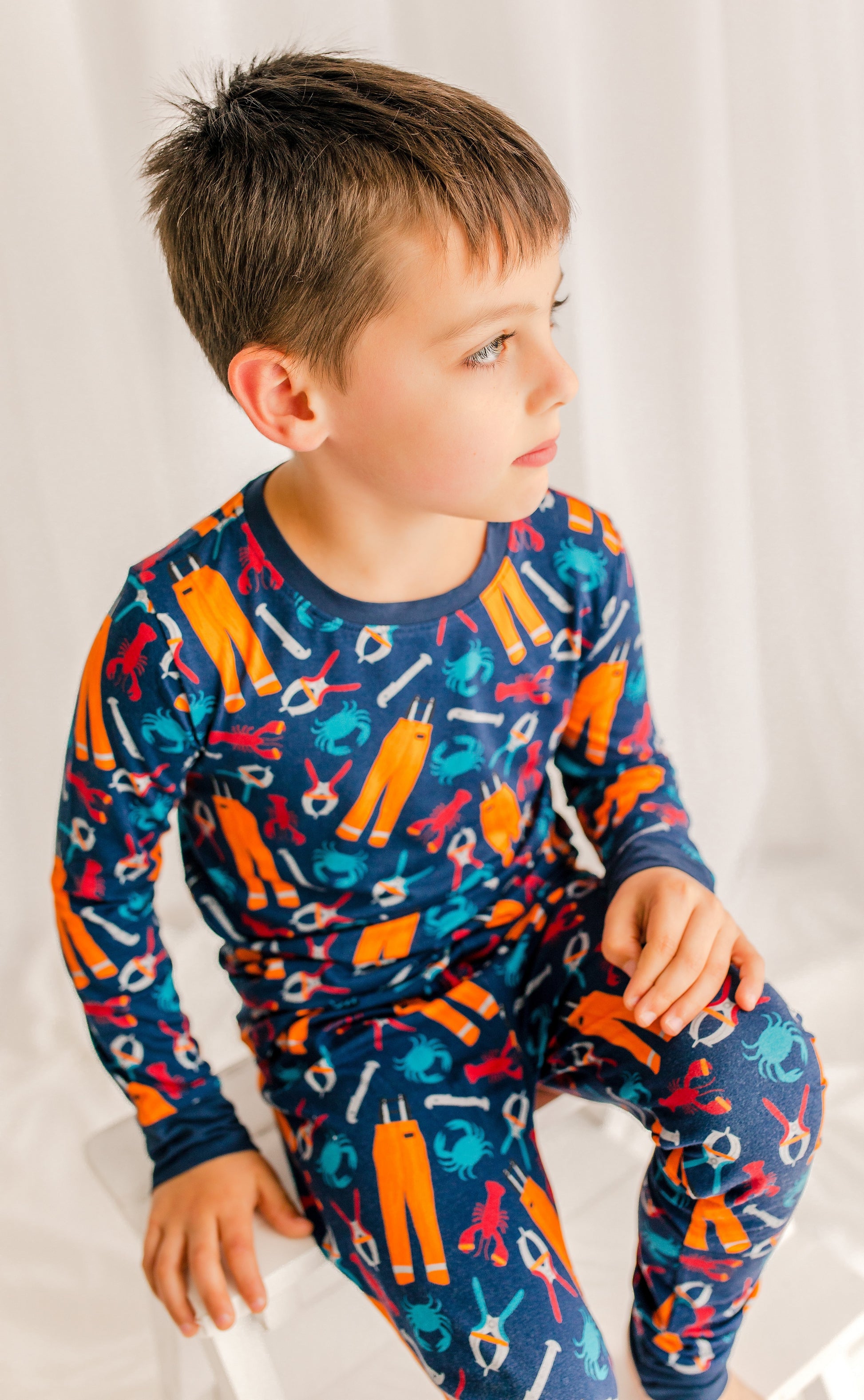 Dark blue background with blue crabs, red lobsters, orange oil gear, banders, and measures. 