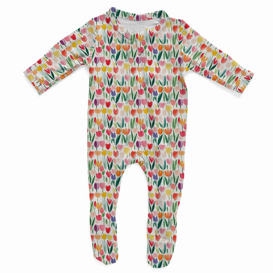 Colorful baby onesie with floral tulip pattern on a white background