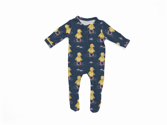 Navy baby onesie with yellow ducks in purple rain boots stomping in puddles with paper boats floating 